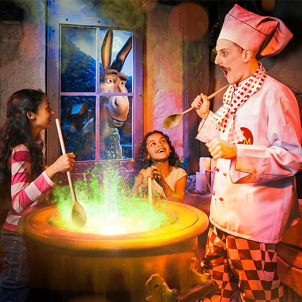 Kids having fun at Shrek Adventure's experience.